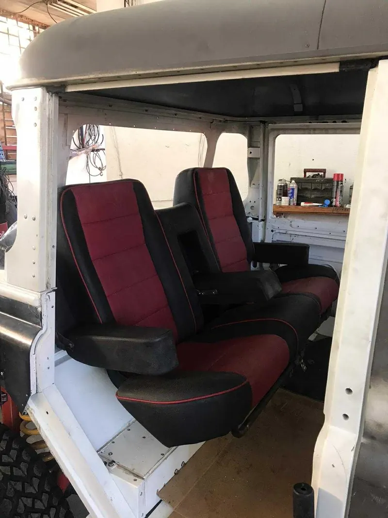 The original burgundy and black interior before the rebuild