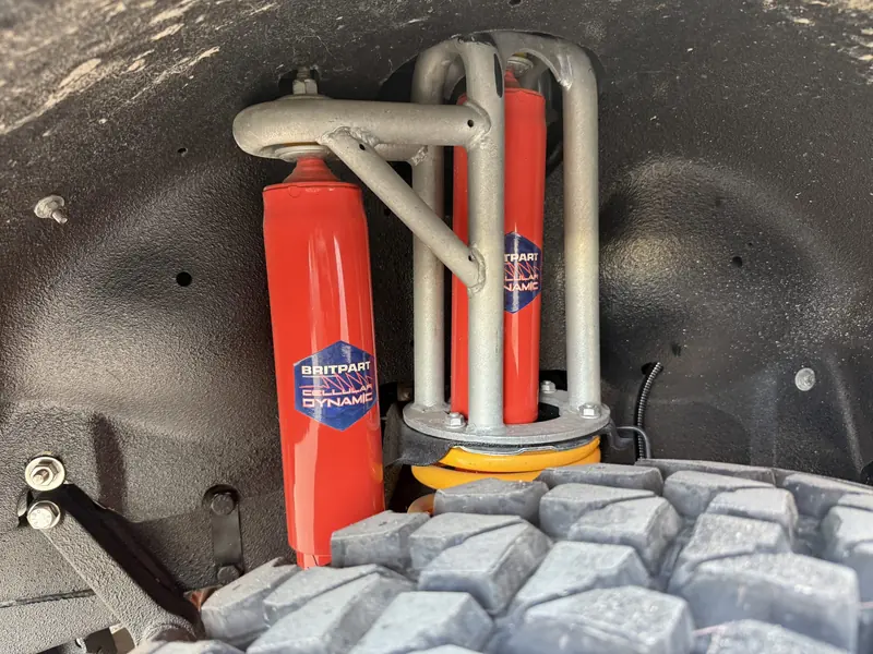 Shock absorber inside the wheel arch